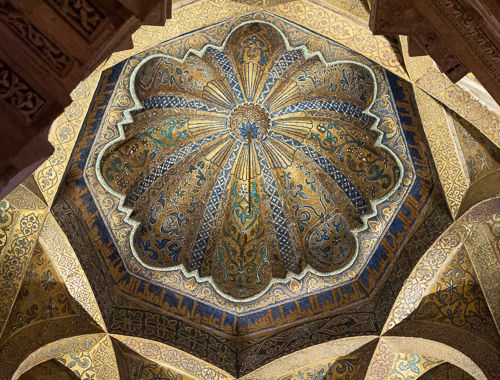 Blue and golden details in ceiling decoration.