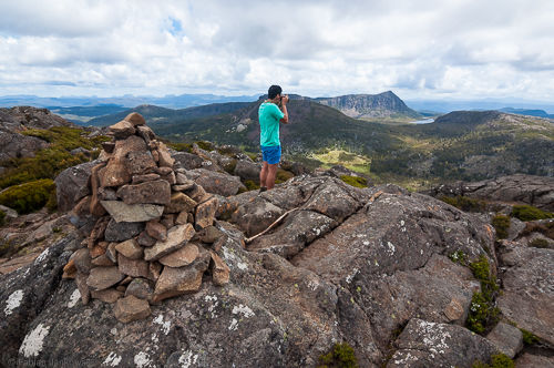 James takes a photo behind the summit cairn on Mt. Jerusalem.